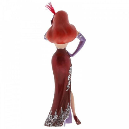 The Enesco Disney Showcase Jessica Rabbit Figurine 6002182 features her wavy red hair, strapless red and white dress, purple gloves, red heels, feathered headpiece, and a pose with one hand on her hip and back turned.