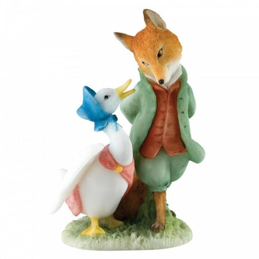 The Beatrix Potter Jemima & The Foxy Whiskered Gentleman figurine features a handpainted fox in a green coat and red vest on grass, gazing at Jemima Puddle-Duck in her blue bonnet and pink shawl, capturing their charming interaction.