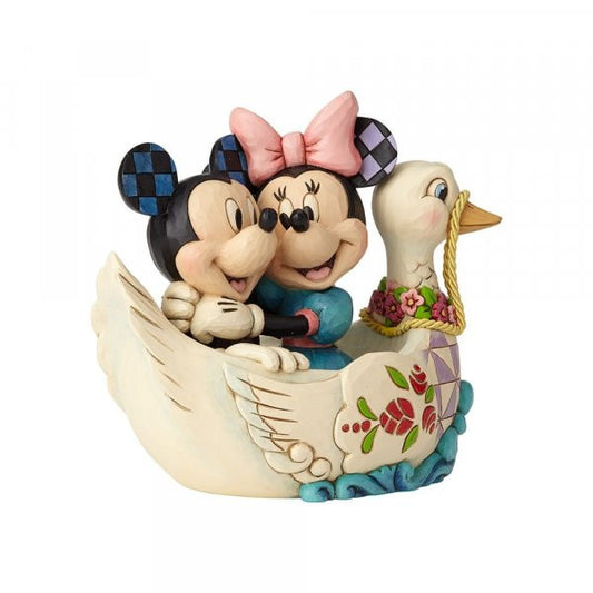 Disney Traditions Mickey and Minnie ride on a swan boat figurine