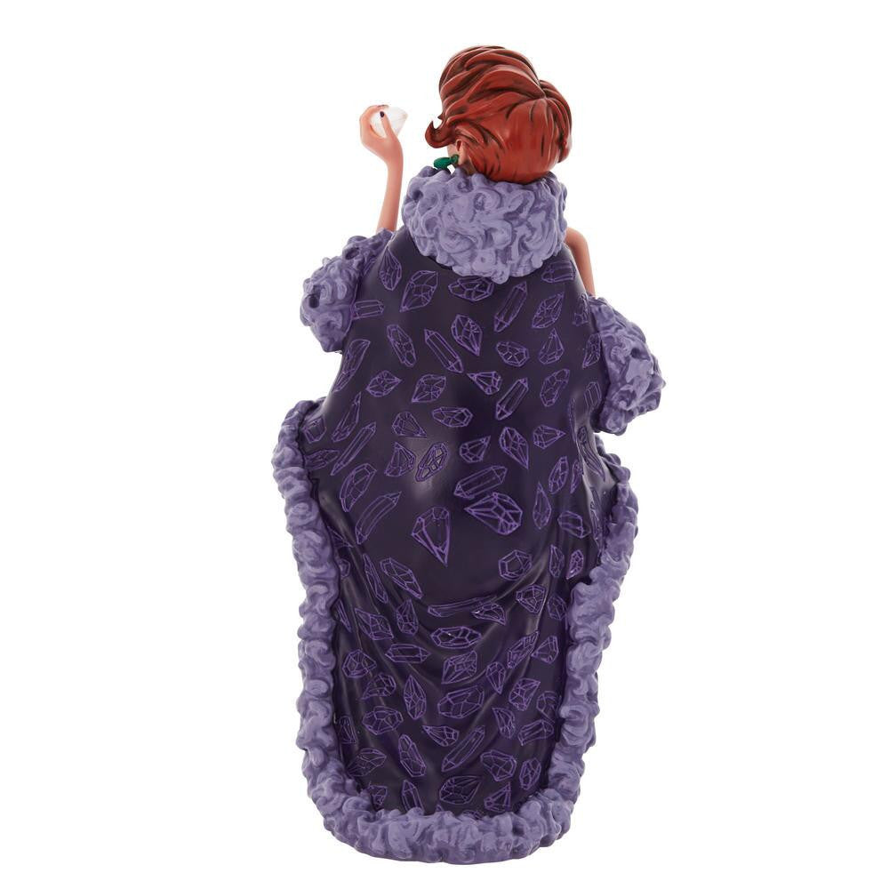 The Enesco Disney Showcase Madame Medusa Figurine 6010728 captures the villain from The Rescuers with red hair in an updo, a long purple fur-trimmed robe with diamonds, and a cigarette holder—all seen from behind.