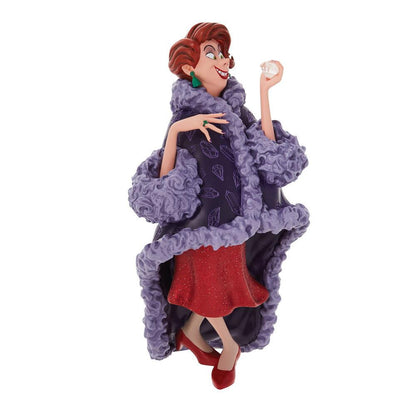 The Enesco Disney Showcase Madame Medusa Figurine 6010728 depicts the Rescuers villain in a purple coat, red dress and heels, green earrings, and glasses, grinning slyly with a diamond in hand.