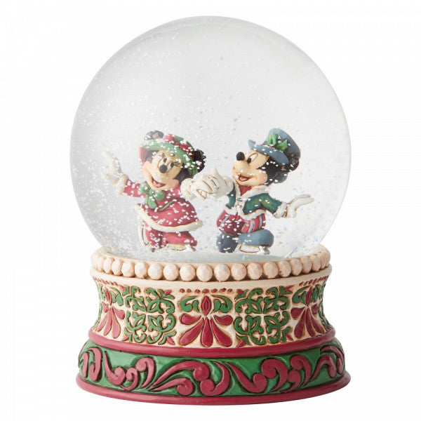 Disney Traditions Mickey and Minnie skating in Victorian garb inside a waterball figurine