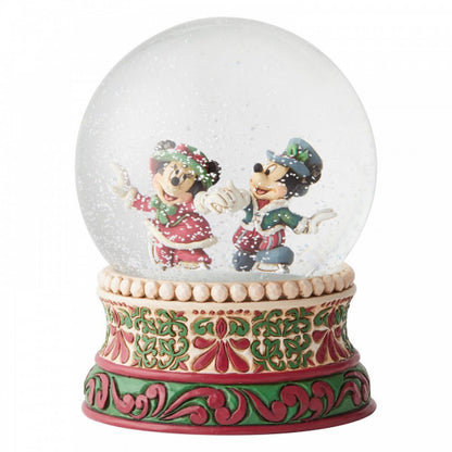 Disney Traditions Mickey and Minnie skating in Victorian garb inside a waterball figurine