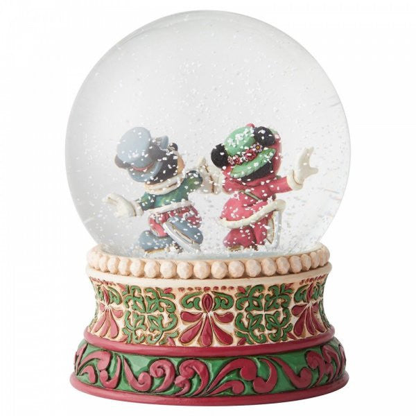 Disney Traditions Mickey and Minnie skating in Victorian garb inside a waterball figurine