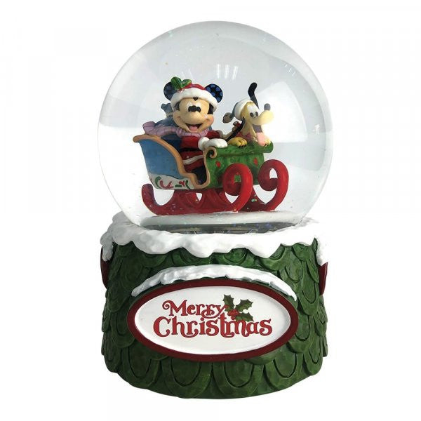 Disney Traditions Mickey plays Santa in his sleigh with his trusty steed, Pluto inside a waterball figurine
