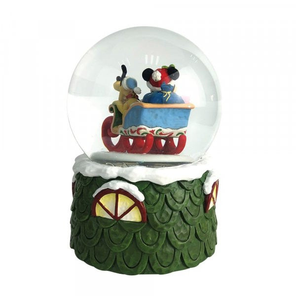 Disney Traditions Mickey plays Santa in his sleigh with his trusty steed, Pluto inside a waterball figurine