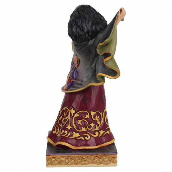 Disney Traditions Mother Gothel flaps her cloak to reveal a tender moment shared between Rapunzel and her parents figurine