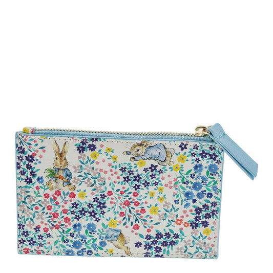The Beatrix Potter Peter Rabbit Garden Party Pop Up Purse is a pastel zippered pouch with a blue tassel, featuring floral patterns and rabbits in clothing inspired by classic garden party scenes.