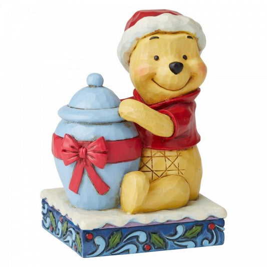 Disney Traditions Winnie the Pooh with a tub full of honey as his Christmas gift figurine