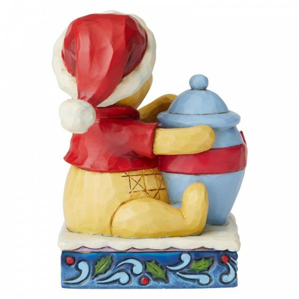 Disney Traditions Winnie the Pooh with a tub full of honey as his Christmas gift figurine