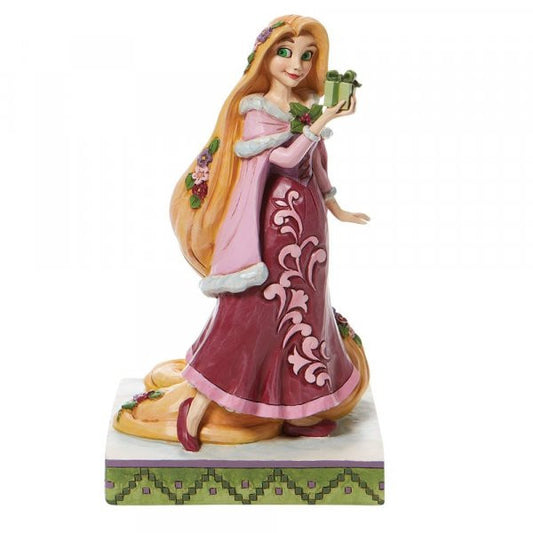 Disney Traditions Rapunzel from Tangled holding a present figurine