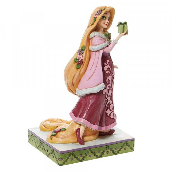 Disney Traditions Rapunzel from Tangled holding a present figurine