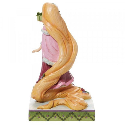 Disney Traditions Rapunzel from Tangled holding a present figurine