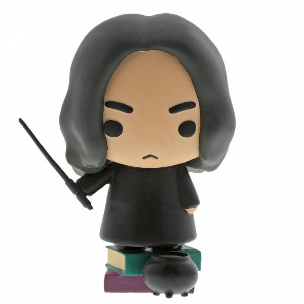 The Enesco Harry Potter Snape Figurine from the CHARMS collection features Snape with long black hair, a black robe, and wand, standing on stacked books beside a cauldron—perfect for Slytherin fans. The figure has a serious expression.