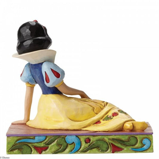 Disney Traditions Snow White in a relaxed seated pose Figurine