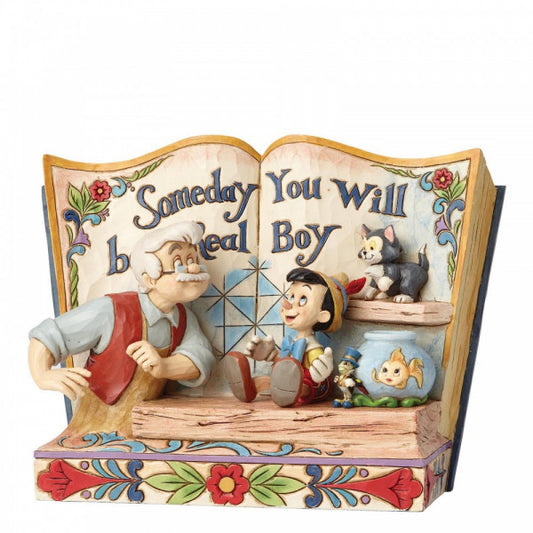 Disney Traditions Pinocchio, Geppetto and Figaro in the workshop on a storybook figurine