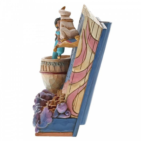 Disney Traditions Aladdin invites Jasmine to join him on the magic carpet on a Storybook figurine