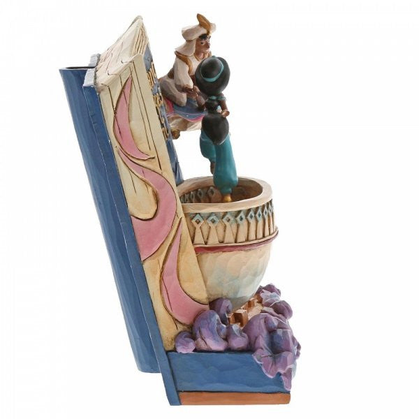 Disney Traditions Aladdin invites Jasmine to join him on the magic carpet on a Storybook figurine