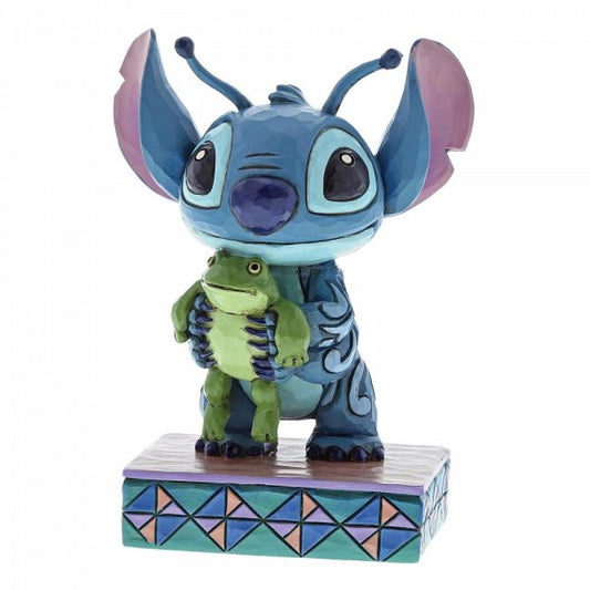 Disney Traditions Stitch, the Alien from Lilo & Stitch holding a frog figurine