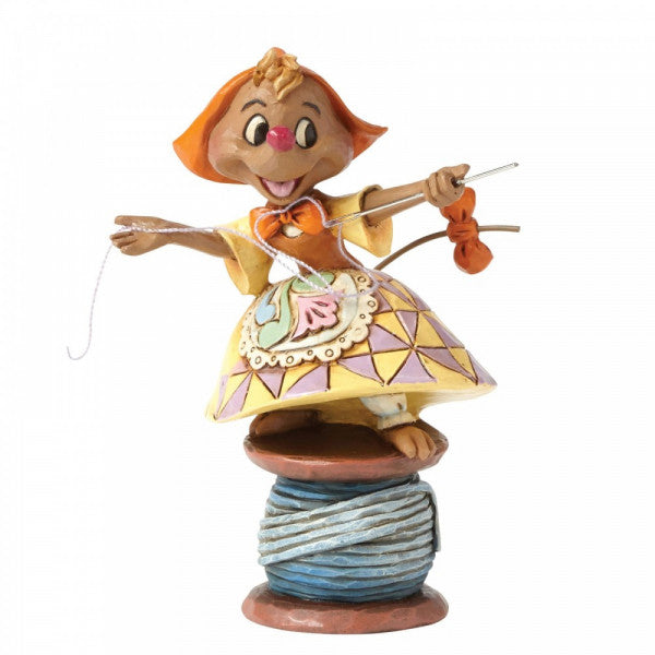 Disney Traditions Suzy the seamstress mouse from Cinderella is perched on a spool of cotton with needle and thread in hand figurine