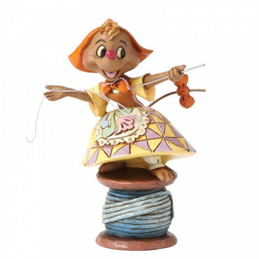 Disney Traditions Suzy the seamstress mouse from Cinderella is perched on a spool of cotton with needle and thread in hand figurine