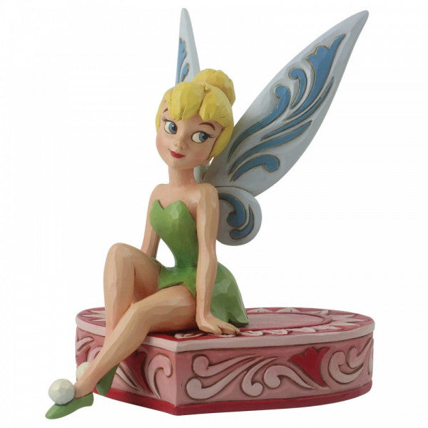 Disney Traditions Tinker Bell the fairy from Peter Pan sits on a heart-shaped box figurine