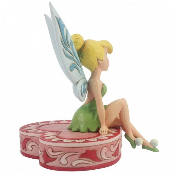 Disney Traditions Tinker Bell the fairy from Peter Pan sits on a heart-shaped box figurine