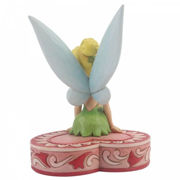 Disney Traditions Tinker Bell the fairy from Peter Pan sits on a heart-shaped box figurine