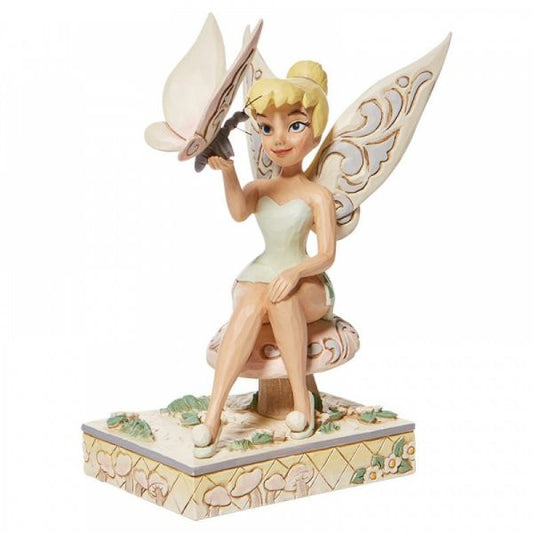 Disney Traditions Tinker Bell, the fairy from Peter Pan sitting on a toadstool with a butterfly figurine