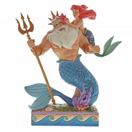Disney traditions Ariel (The Little Mermaid) places a flower in father Triton's hair. Triton stands on his tail with gold trident in hand figurine