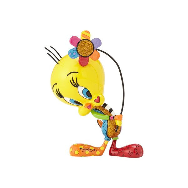 The Enesco Looney Tunes Britto Tweety with Flower Figurine features Tweety Pie bending forward and smiling, with a large flower on its head, adorned in bright patterns and whimsical designs on its oversized feet.