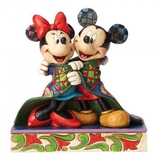 Disney Traditions Mickey and Minnie cuddle under a blanket figurine