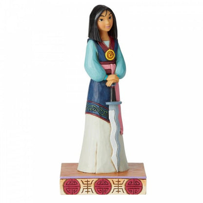 Disney Traditions Mulan holds Shan Yu's sword and wears the Emperor's crest figurine