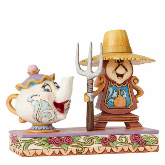 Disney Traditions Cogsworth and Mrs. Potts from Beauty and the Beast create a playful interpretation of a classic painting figurine