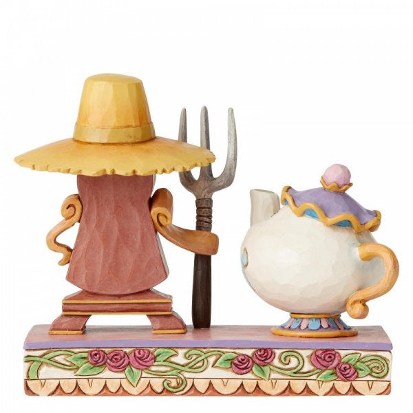 Disney Traditions Cogsworth and Mrs. Potts from Beauty and the Beast create a playful interpretation of a classic painting figurine