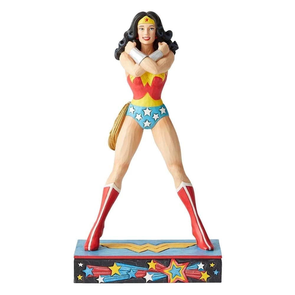 The DC Wonder Woman Amazonian Princess Silver Age Figurine by Jim Shore features Wonder Woman in her classic red, blue, and gold costume, arms crossed, standing on a decorated base with her golden lasso at her side.