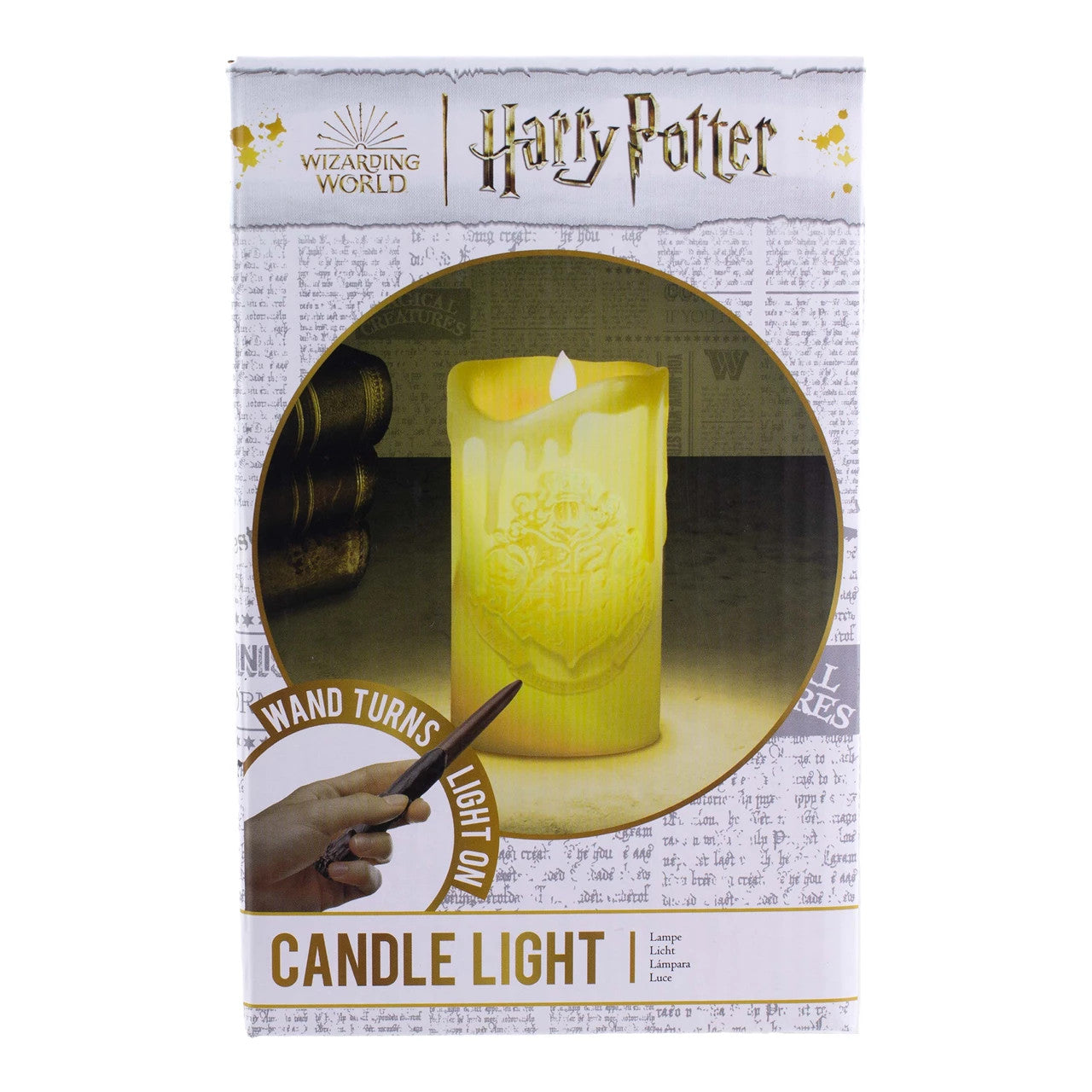 The Paladone Harry Potter Candle With Wand Remote Control Light comes in packaging with a golden Hogwarts crest and text highlighting the magic wand remote. A newspaper-style background adds an extra magical touch.