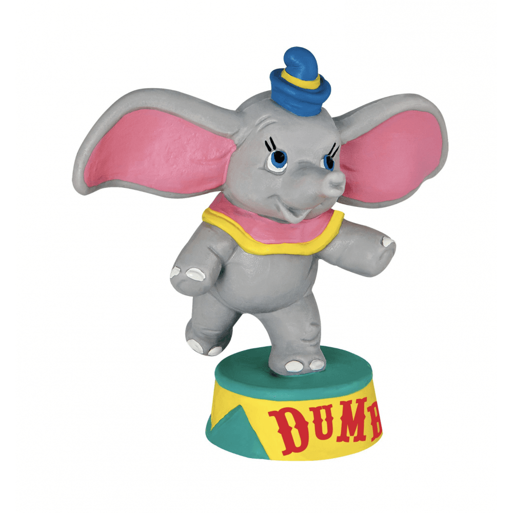The Bullyland Disney Dumbo Figurine features Dumbo, the gray circus elephant with large pink ears, wearing a yellow collar and blue hat, standing on a pedestal labeled DUMBO. Brand: Bullyland.