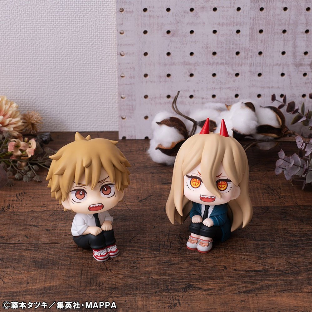 The Bandai Namco Chainsaw Man Look Up Figure Denji & Power Limited Edition features two chibi-style PVC statues with unique blond hairstyles and fangs, displayed on a wooden surface—ideal for any Chainsaw Man fan.