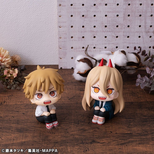 The Bandai Namco Chainsaw Man Look Up Figure Denji & Power Limited Edition features two chibi-style PVC statues with unique blond hairstyles and fangs, displayed on a wooden surface—ideal for any Chainsaw Man fan.