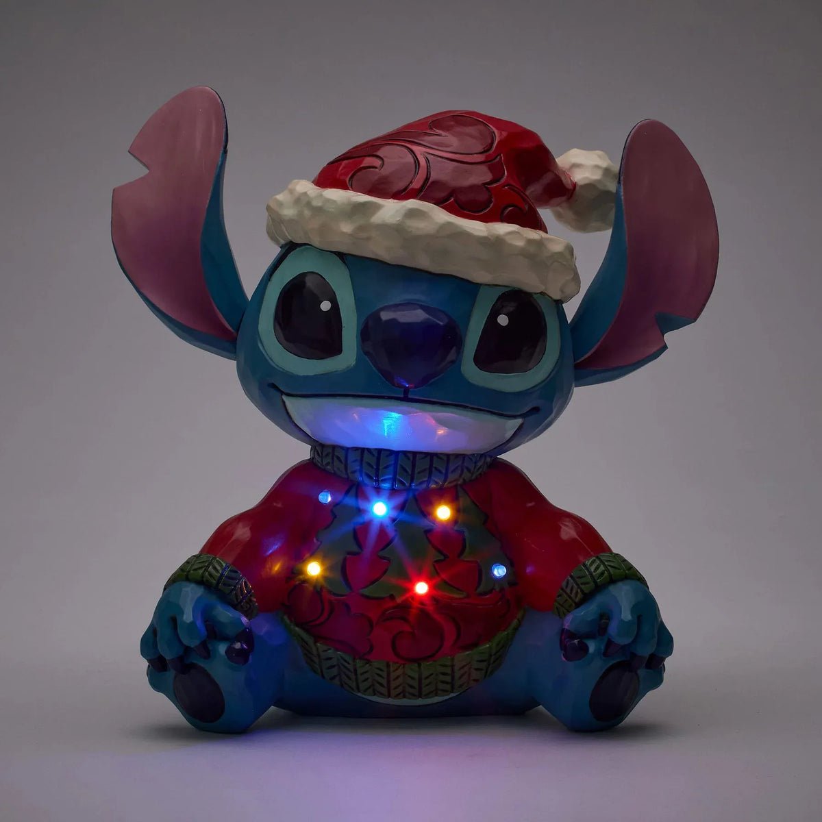 Disney Traditions Feeling Jolly and a Little Naughty (Stitch Sweater LED) Figurine by Jim Shore