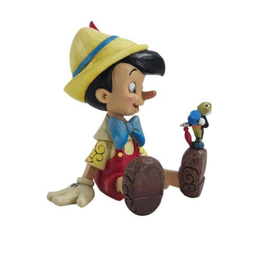Disney Traditions Wishful and Wise Pinocchio and Jiminy Sitting Figurine By Jim Shore 6011934 Disney Traditions Wishful and Wise Pinocchio and Jiminy Sitting Figurine By Jim Shore 6011934