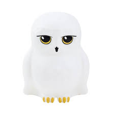 The Harry Potter Hedwig Light by Paladone is a white, cartoon-style owl figurine with large yellow and black eyes, a small black beak, and yellow claws, inspired by Hedwig from Harry Potter.