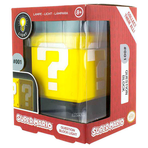 The Super Mario Bros. Question Block 3D Light by Paladone comes in a red and yellow box for ages 8+, featuring the Super Mario logo and displaying the yellow question block lamp inside.