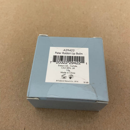 A small blue gift box from Beatrix Potter holds a Peter Rabbit Lip Balm Triple Pack, labeled with a barcode, noting it is made in China and weighs 10g.