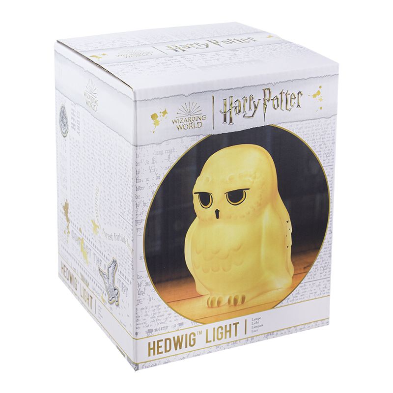 A boxed 3D Hedwig owl light by Paladone, visible through a clear window on white and gold packaging labeled “Harry Potter Hedwig Light”—a magical collectible for Wizarding World fans.