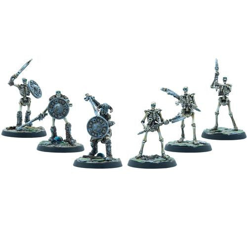 Six painted Skeleton Warriors from Modiphius’s The Elder Scrolls Call To Arms Skeleton Horde stand in dynamic poses with swords and shields on rocky bases—ideal for expanding your miniatures collection.