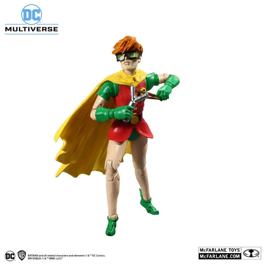 McFarlane Toys DC Multiverse Robin Dark Knight Returns Build-A-Fig 15436 action figure posed with a slingshot, red tunic, yellow cape, and green gloves against a white background with Batman and McFarlane Toys logos.