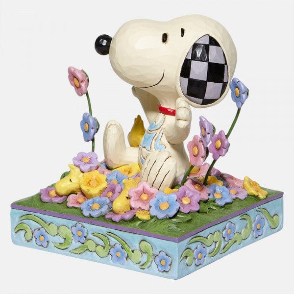 Snoopy in bed of Flowers Figurine By Jim Shore