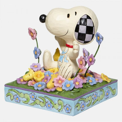 Snoopy in bed of Flowers Figurine By Jim Shore